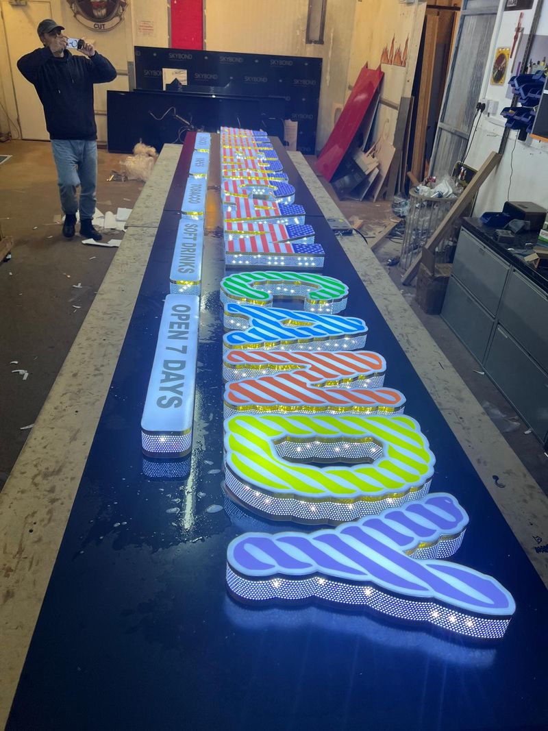 Large built-up illuminated letters being finished in the Bolton workshop