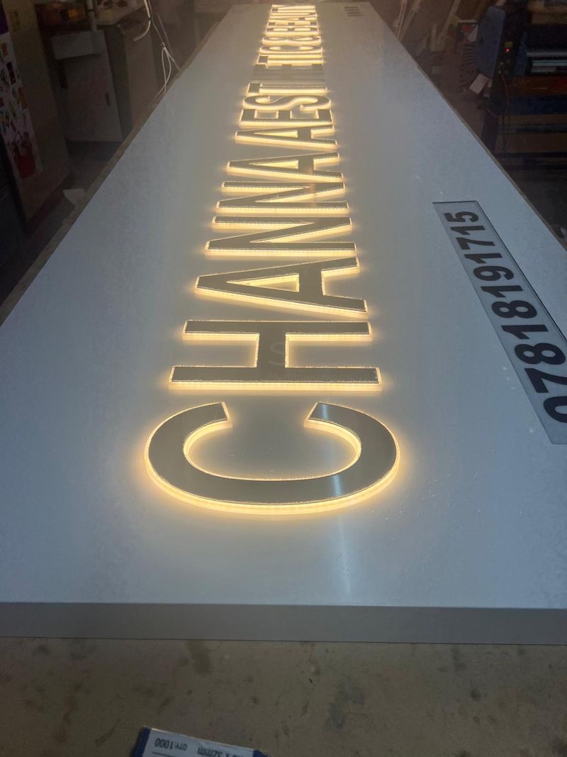 Warm halo-lit gold built-up letters for Chanmaest