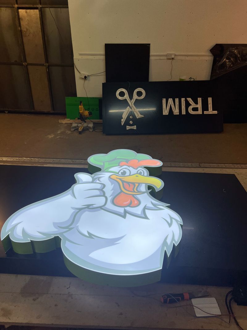 Custom printed vinyl character graphic for a barber shop interior