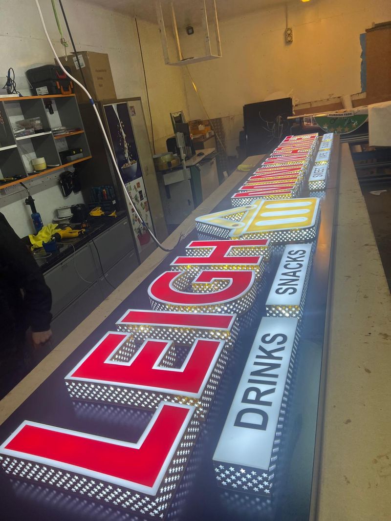 Colourful illuminated built-up letters for Leigh Mini Market