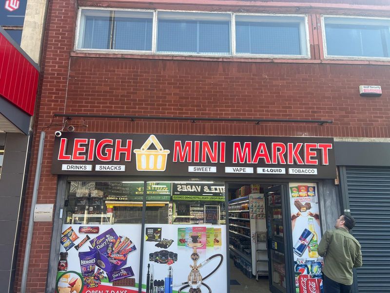 Illuminated Leigh Mini Market convenience store shopfront
