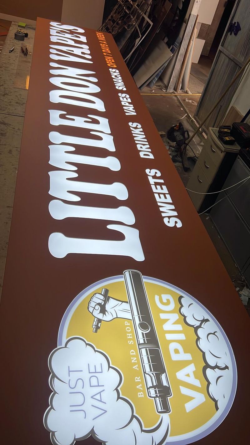 Illuminated projecting lightbox sign for Little Don Vapes