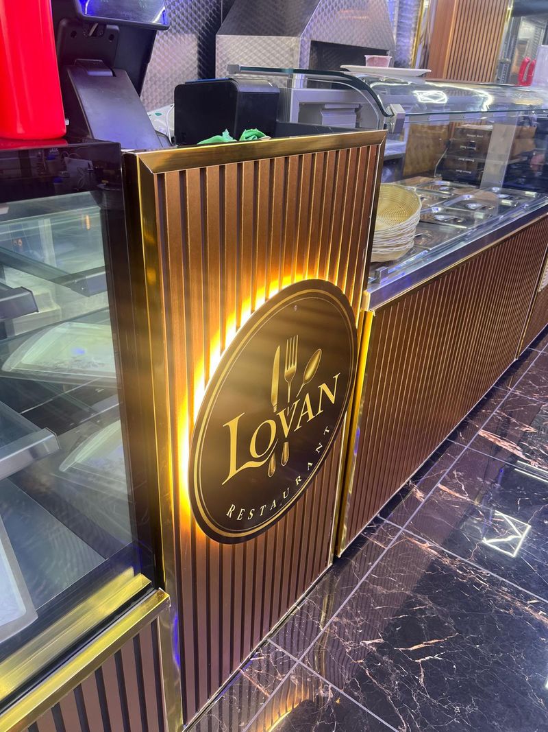 Premium gold and black restaurant counter shop fitting for Lovan