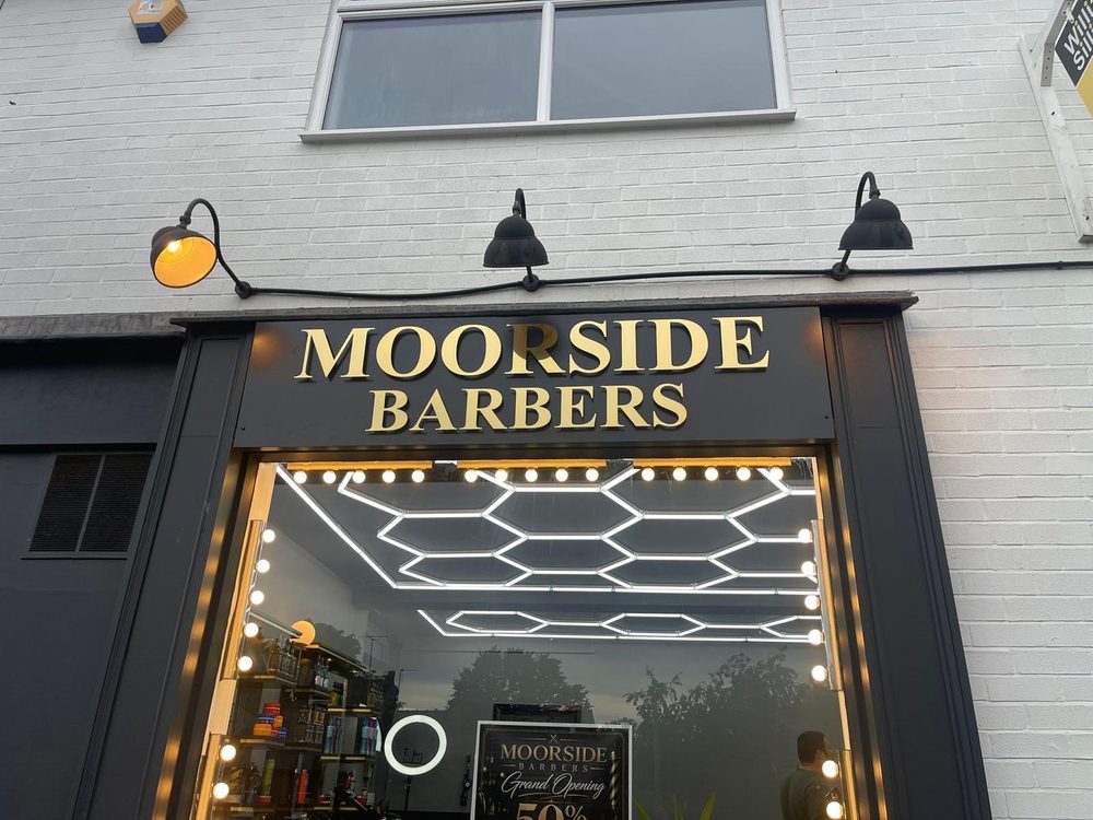 Premium illuminated entrance and window signage for Moorside Barbers