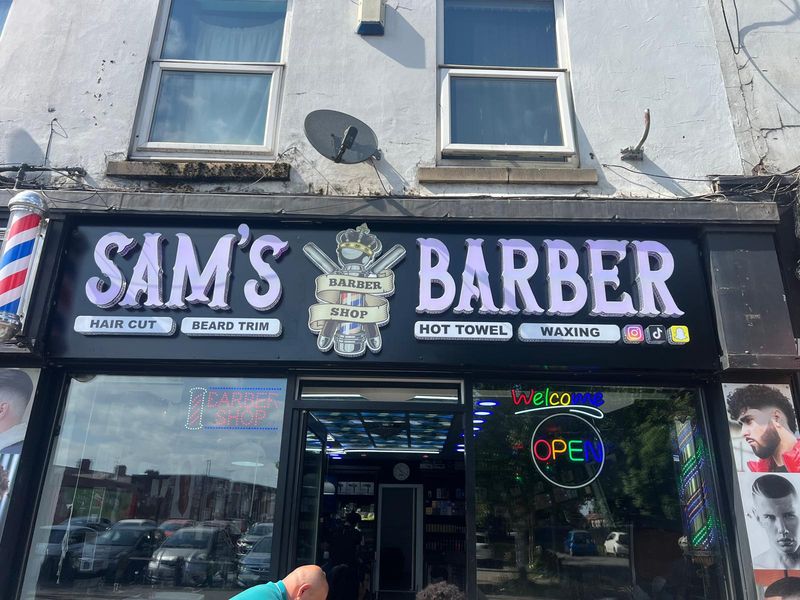 Full illuminated shopfront signage and barber pole for Sam's Barber