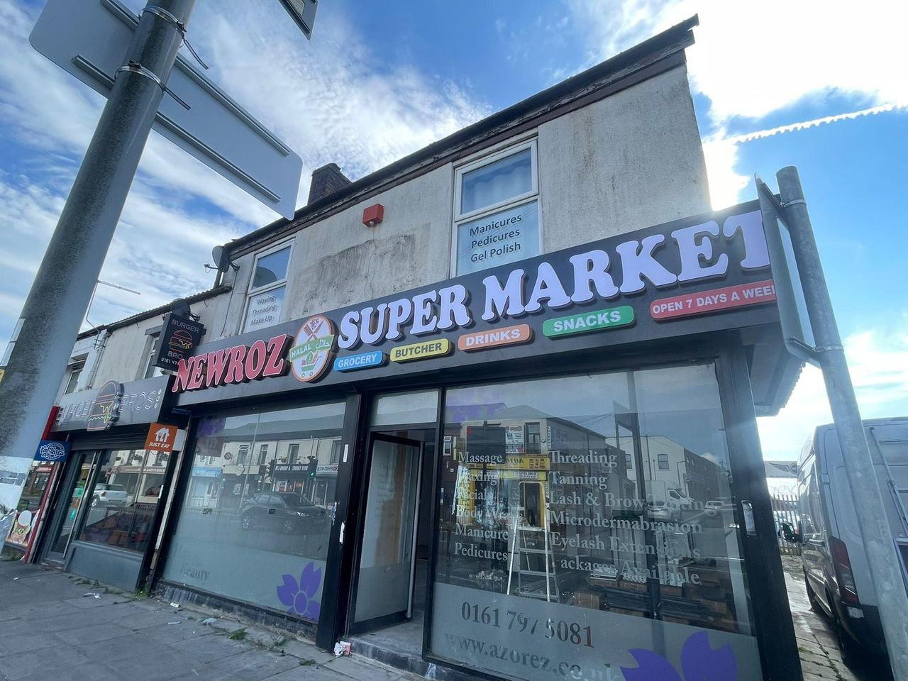 Large illuminated Newroz Supermarket shopfront sign made by Galaxy Signs in Bolton